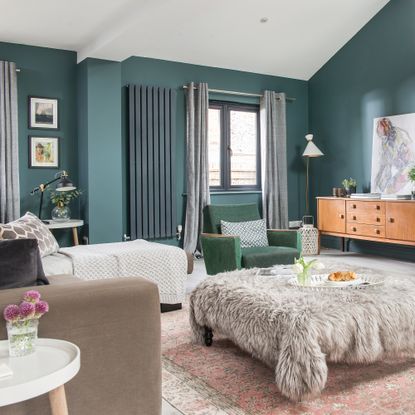 Dark blue living room with modern radiator and grey window