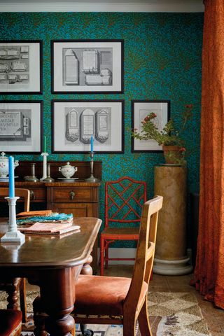 Morris & Co wallpaper in a dining room with wooden furniture