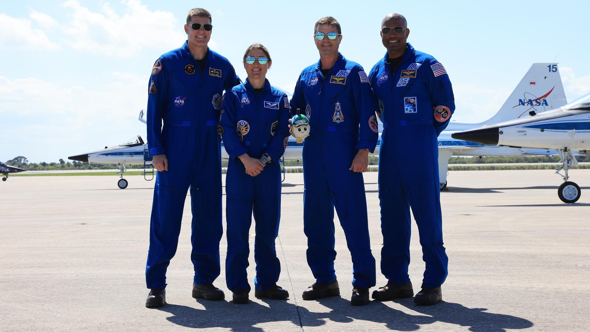 The Artemis II crew posed with their mascot, "Rise," when they arrived at Kennedy Space Center on Friday (March 27).