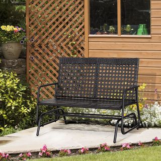 Black garden bench in outdoor space