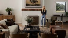 amber lewis in a living room filled with her furniture collection with four hands