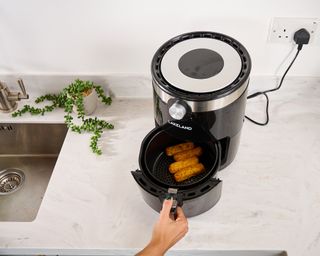Real Homes eCommerce editor Christina Chrysostomou cooking fish fingers in Lakeland Digital Crisp Air Fryer