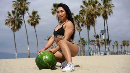 Watch this female weightlifter attempt to crush a watermelon with her  thighs