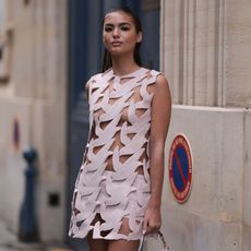 Woman in pink cut out mini dress GettyImages-2065944827