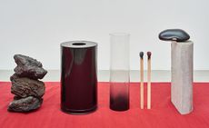 selection of art sculptures on a red base