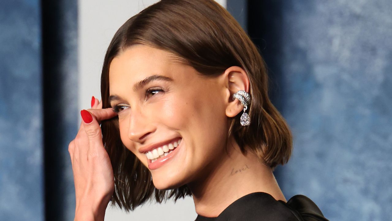 Hailey Bieber with red manicure celebrity nail trends