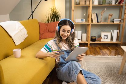 Portrait of a girl using tablet and shopping online