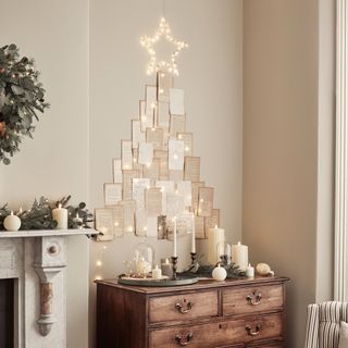 DIY paper Christmas tree mounted on wall with with star light