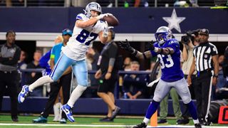 Tight end Jake Ferguson #87 of the Dallas Cowboys makes a catch in the end-zone as safety Jamal Adams #33 of the Seattle Seahawks defends during the 4th quarter of the game at AT&T Stadium on November 30, 2023