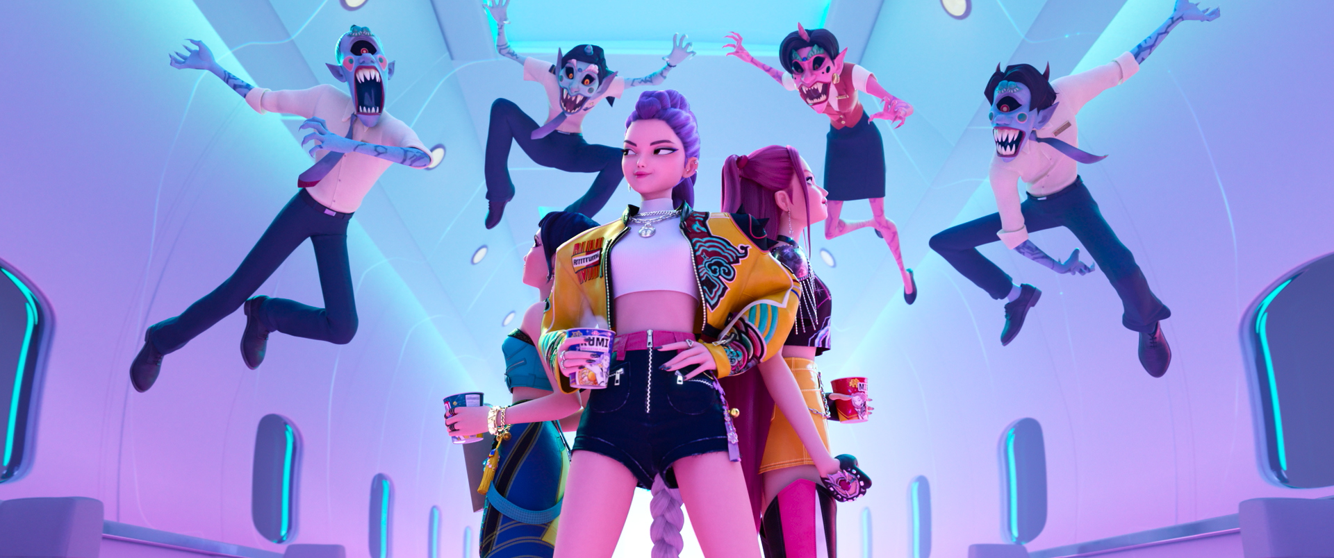 Three women (Zoey, Rumi, and Mira) stand back-to-back as four demons jump toward them, in 'KPop Demon Hunters.'