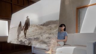 A woman watches a movie on a virtual screen on the Xreal One smart glasses