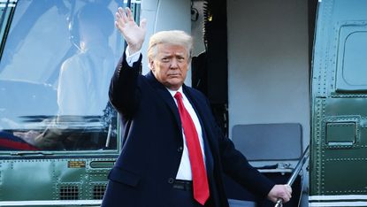 Donald Trump waves as he boards Marine One