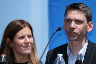 Derek Bouchard-Hall (R) CEO of USA Cycling addresses the media as Kristin Bachochin Klein (L) President of AEG Cycling looks on during a press conference at the San Diego Yacht Club ahead of the 2016 Amgen Tour of California