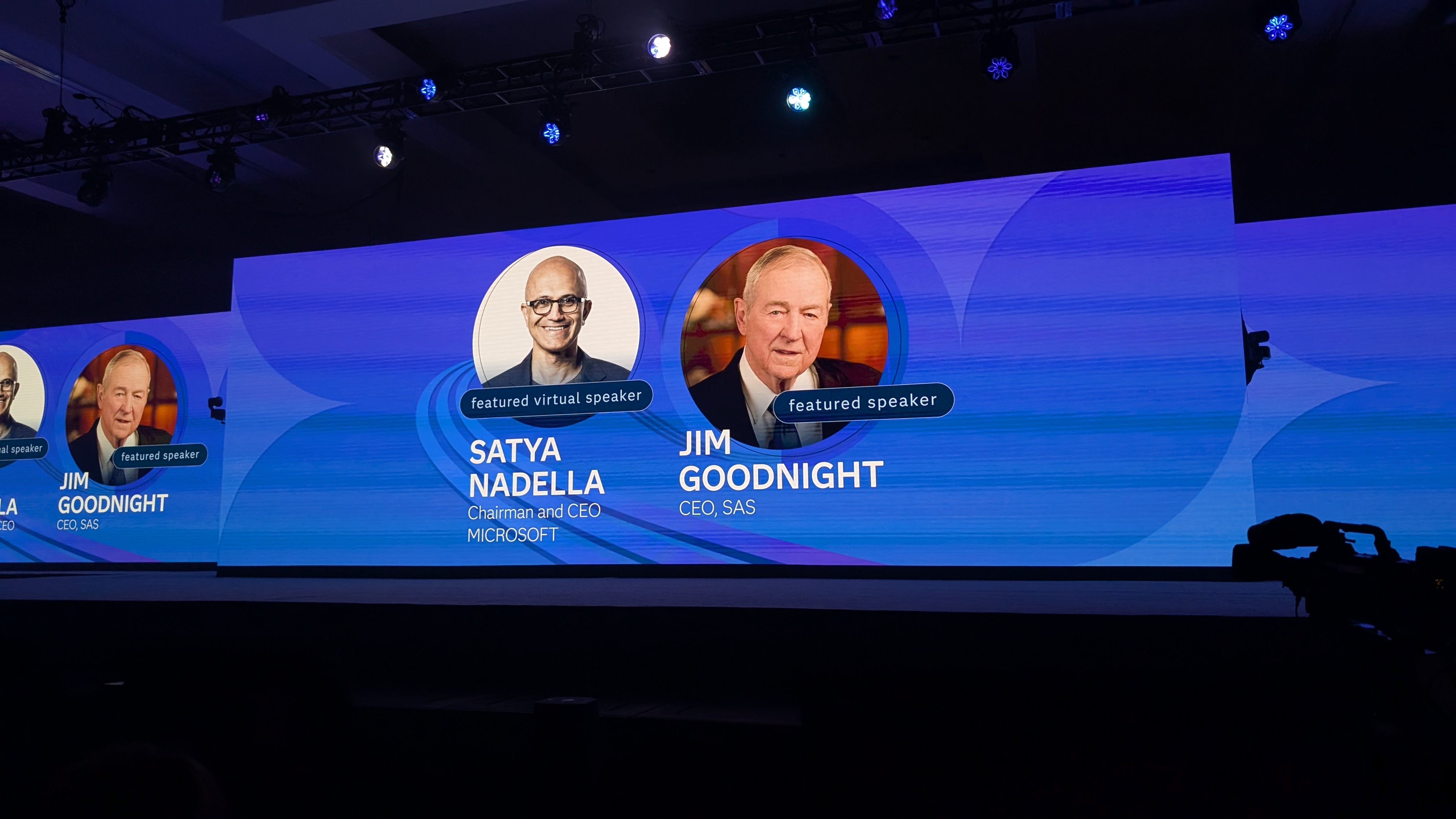 The keynote stage at SAS Innovate 2025, showing both Satya Nadella, chairman and CEO at Microsoft, and Jim Goodnight, CEO at SAS, against a blue background.