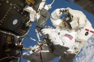 NASA astronaut Thomas Marshburn completing a spacewalk during STS-127 in 2009.