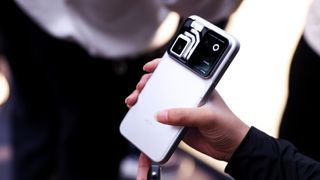 The Honor Robot Phone held in a person's hand with the camera folded