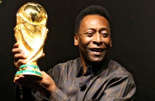 Pele with the World Cup trophy in 2010.