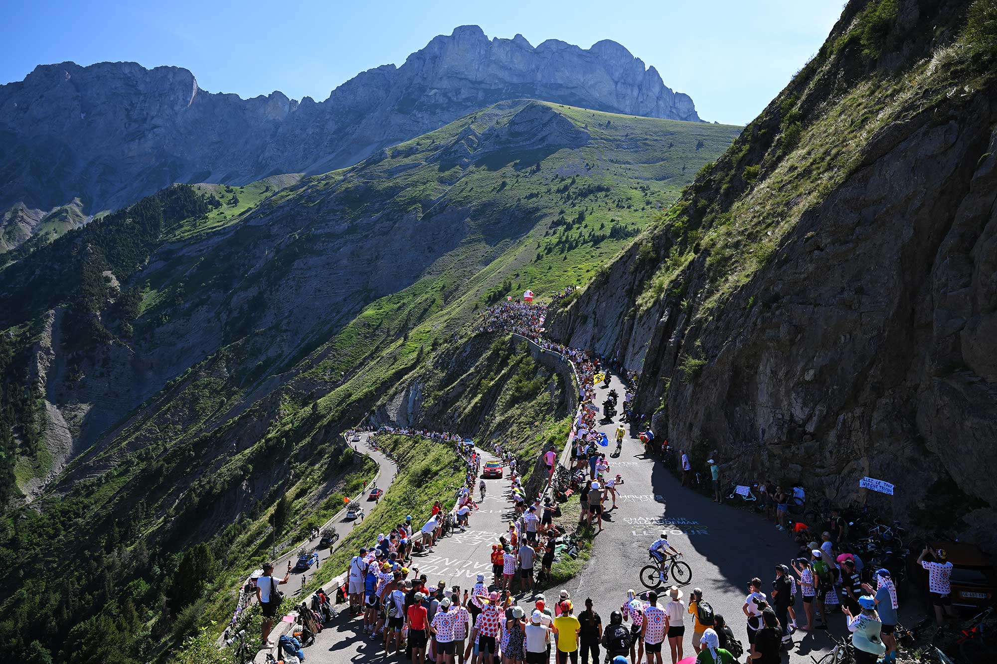 Riders climbing the Col du Noyer (1664m) while fans cheer during the 111th Tour de France 2024 (Photo by Tim de Waele/Getty Images)