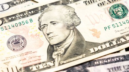 Close up of ten dollar banknote with portrait of Alexander Hamilton 