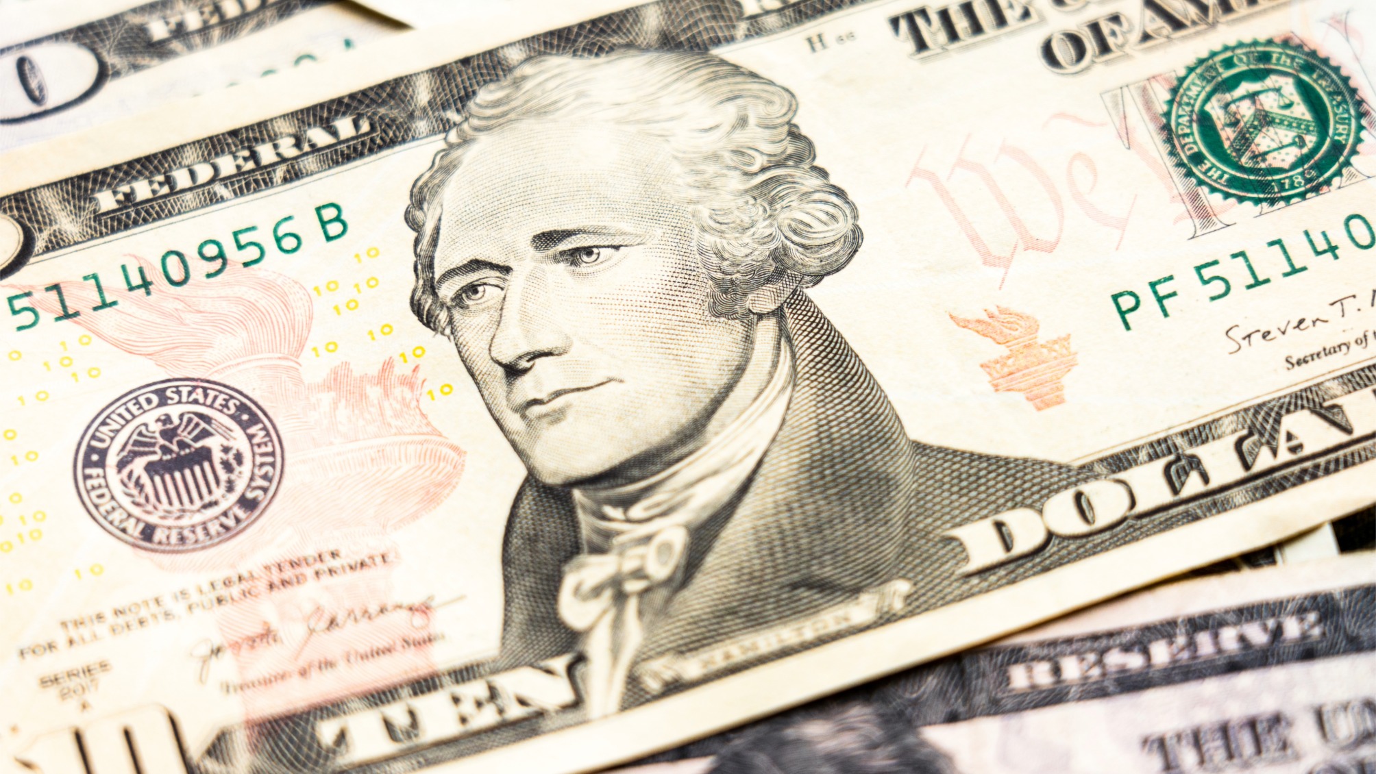 Close up of ten dollar banknote with portrait of Alexander Hamilton 