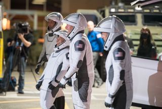 From left to right, ESA astronaut Thomas Pesquet, JAXA astronaut Akihiko Hoshide, and NASA astronauts Shane Kimbrough and Megan McArthur prepare to depart the Neil A. Armstrong Operations and Checkout Building for Launch Complex 39A during a dress rehearsal prior to the Crew-2 mission launch, on April 18, 2021, at NASA's Kennedy Space Center in Florida.