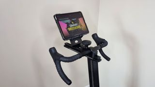 Wattbike Proton smart bike, a close-up photo of the handlebars and device holder