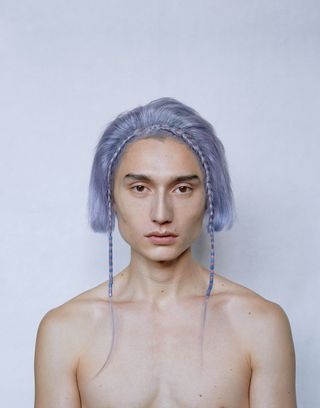 man in wig with short light purple hair