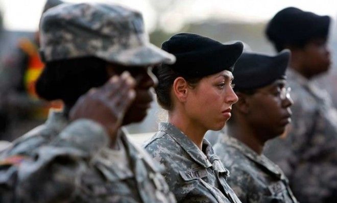 U.S. Army soldiers salute during a 2009 memorial service