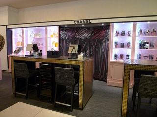 The ephemeral beauty bar, lined with pink shelves and dressed with displays of Chanel perfume bottles