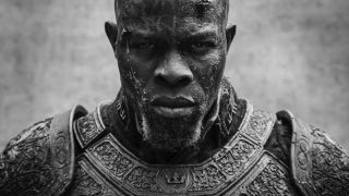 a black and white portrait of a man in futuristic-looking armor