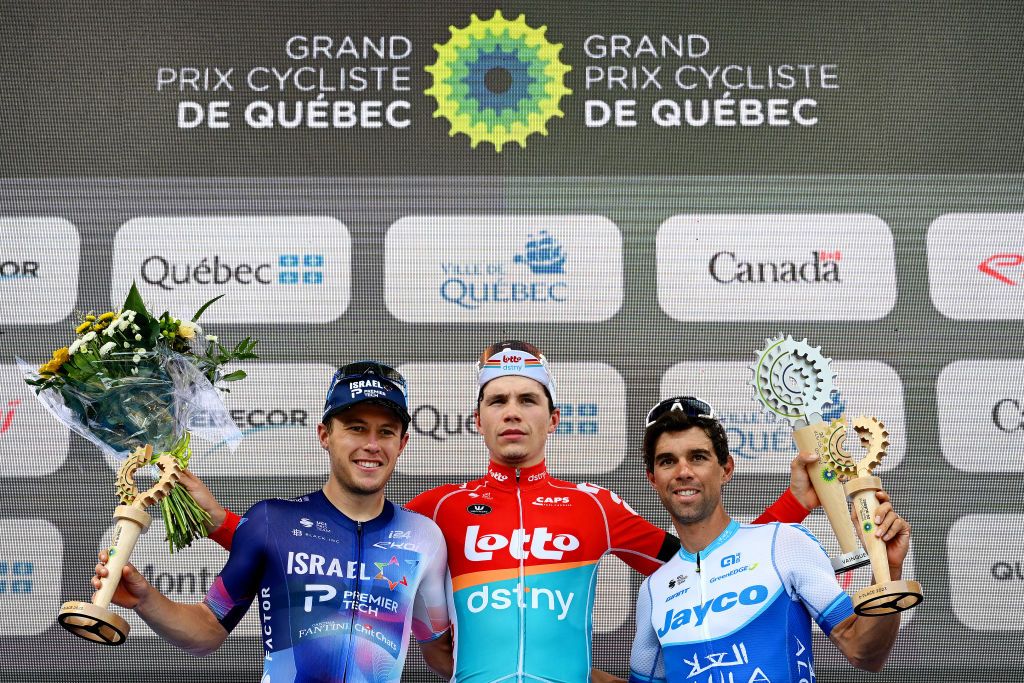 QUEBEC CITY QUEBEC SEPTEMBER 08 LR Corbin Strong of New Zealand and Team IsraelPremier Tech on second place race winner Arnaud De Lie of Belgium and Team Lotto Dstny and Michael Matthews of Australia and Team Jayco AlUla on third place pose on the podium ceremony after the 12th Grand Prix Cycliste de Qubec 2023 a 2016km one day race from Quebec to Quebec 92m UCIWT on September 08 2023 in Quebec City Quebec Photo by Dario BelingheriGetty Images