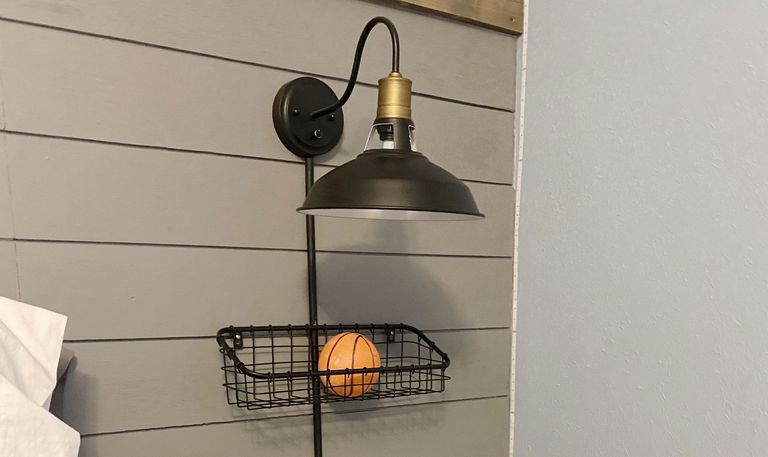 Black wall sconce with hidden lamp cords