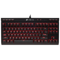 The Corsair K63 is a compact mechanical keyboard with Cherry MX Red switches. It features dedicated volume and media controls and red LED backlighting.