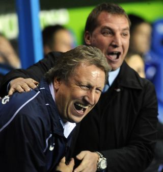 During his time in charge of Reading, the Northern Irishman enjoys a joke with then Crystal Palace boss Neil Warnock