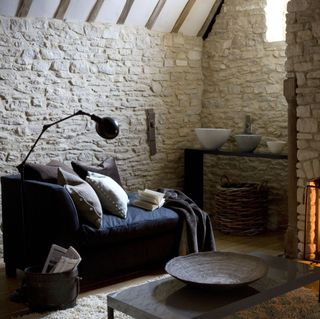 cosy living room with open fire and chaise longue