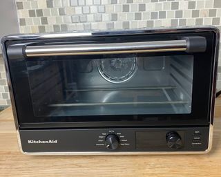 KitchenAid Digital Countertop Oven on wooden countertop with blue tape removed