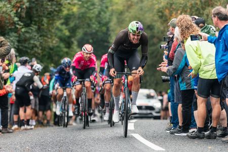 Rowan Baker riding for Saint Piran, climbing on the hoods 