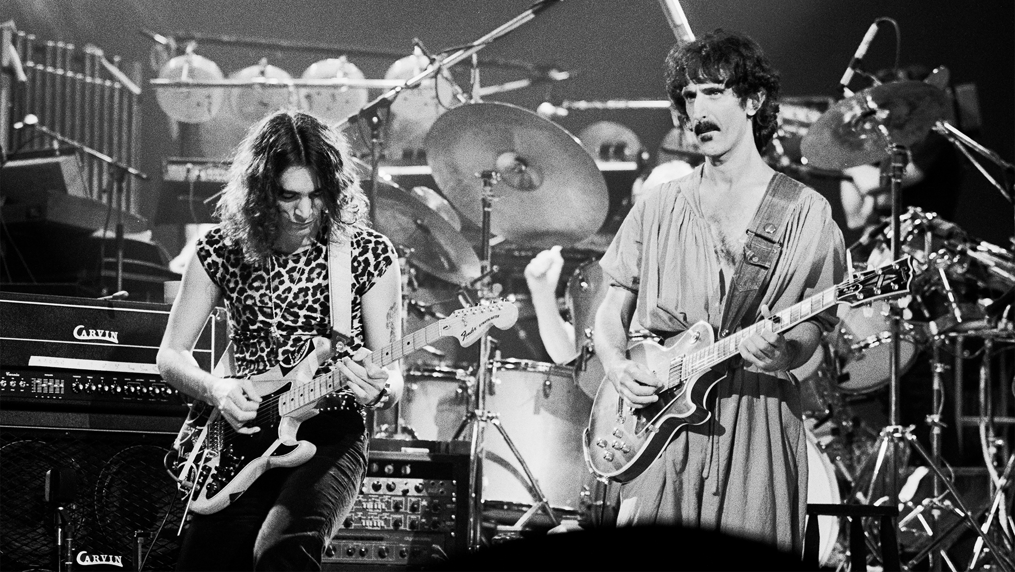 American musicians Steve Vai (left) and Frank Zappa (1940 - 1993), both on guitar, perform on stage at the Palladium, New York, New York, October 31, 1981