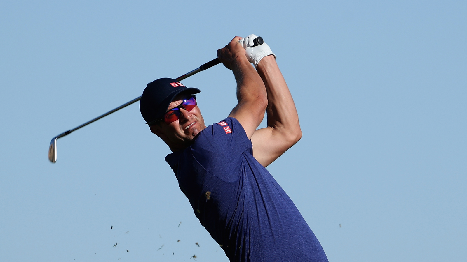 Adam Scott hits an iron