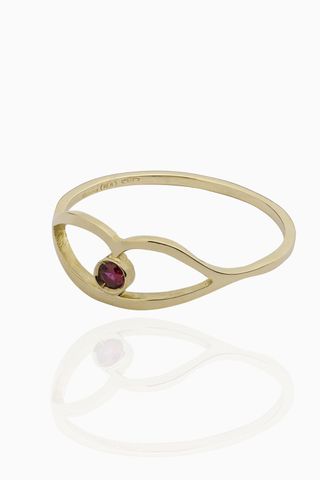 gold ring with lip detail and ruby stone