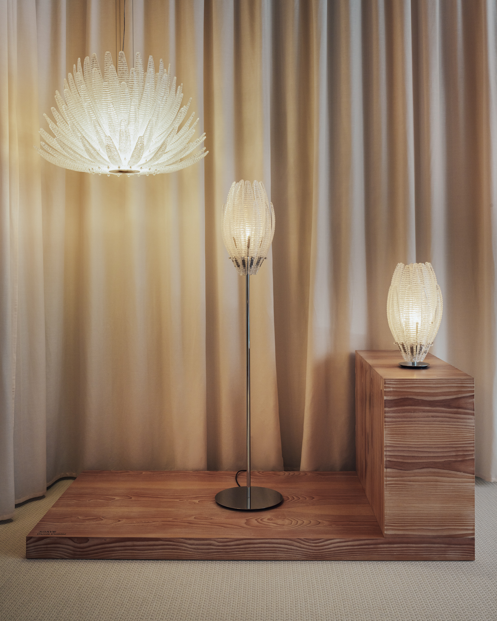glass lamps in front of a curtain