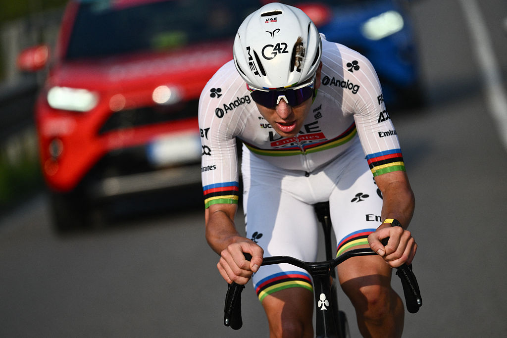 UAE Team Emirates’s Slovenian rider Tadej Pogacar cycles in a lone breakawy in the Passo Di Ganda descent during the 119th edition of the Giro di Lombardia (Tour of Lombardy), a 238km cycling race from Como to Bergamo on October 11, 2025. (Photo by Marco BERTORELLO / AFP)