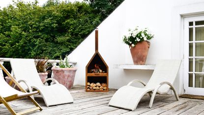 outdoor heating ideas: ivyline fireplace on terrace