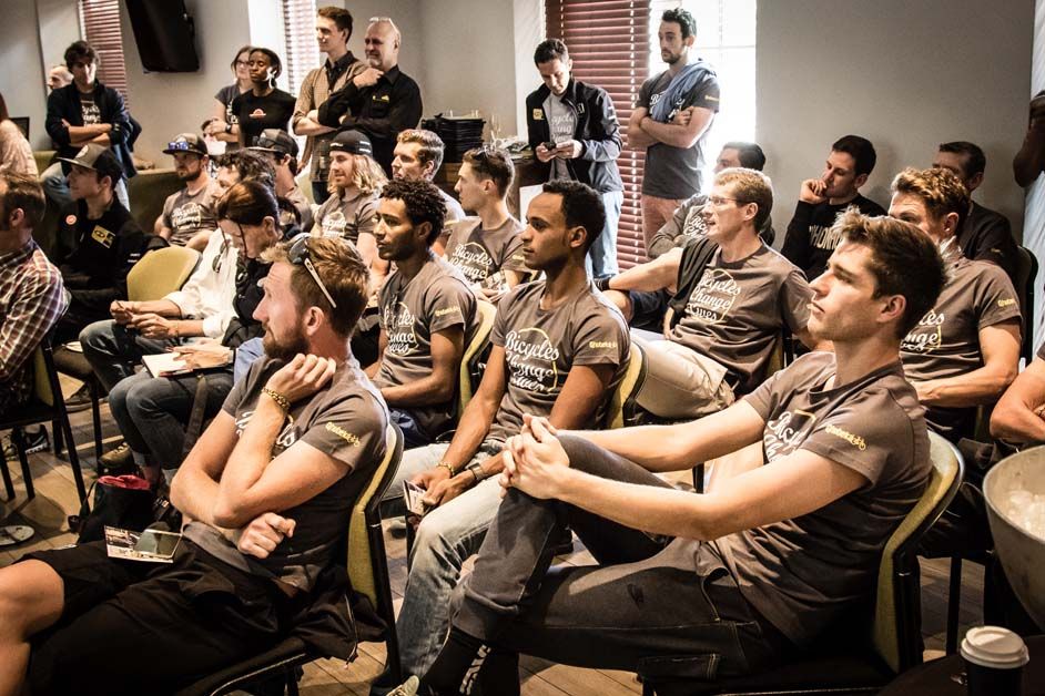 The team listen to some facts about the Qhubeka charity