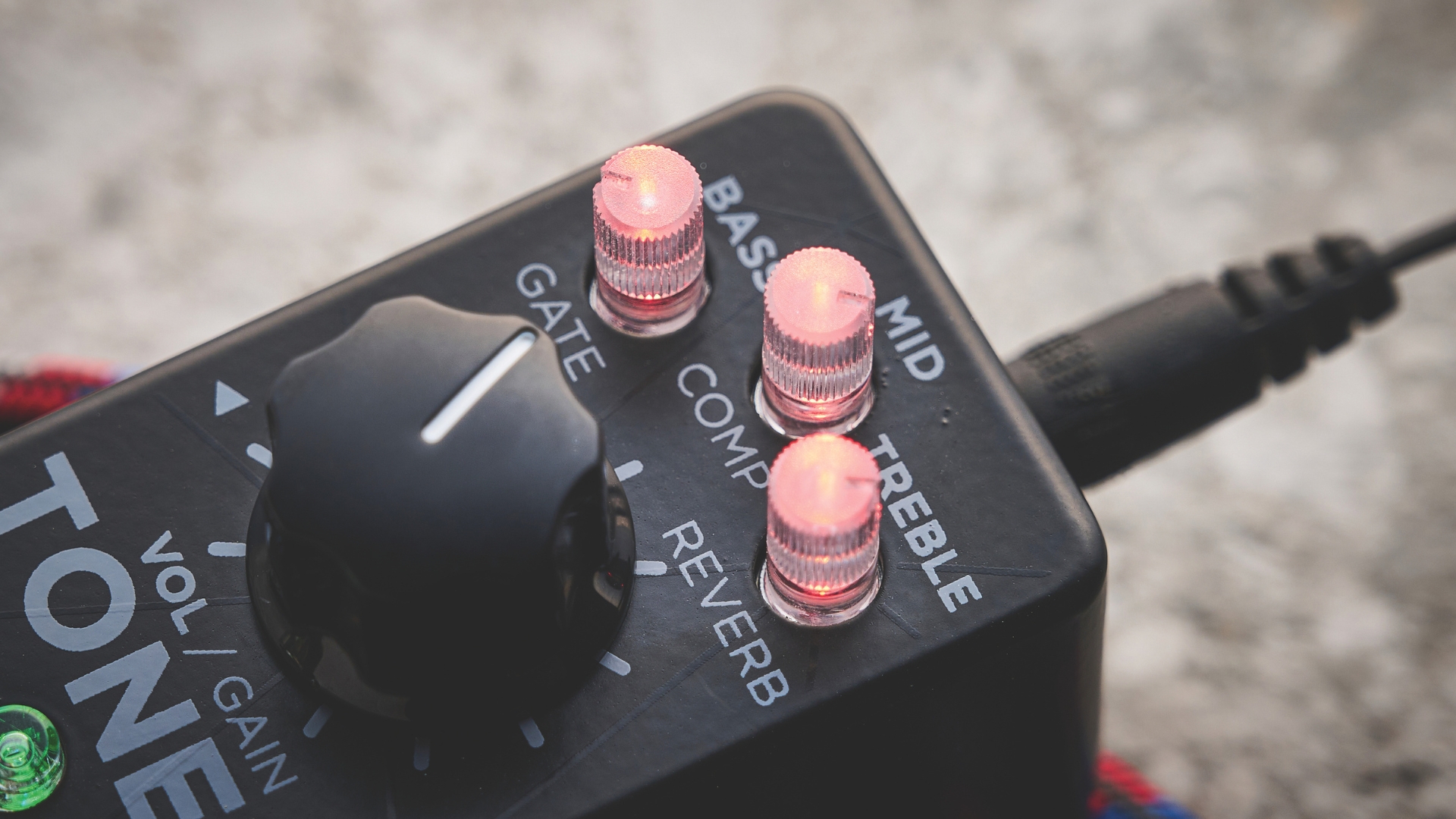 Close up of the controls on an IK Multimedia Tonex One amp simulator pedal