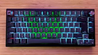 Corsair K65 Plus Wireless keyboard with RGB on a wooden desk