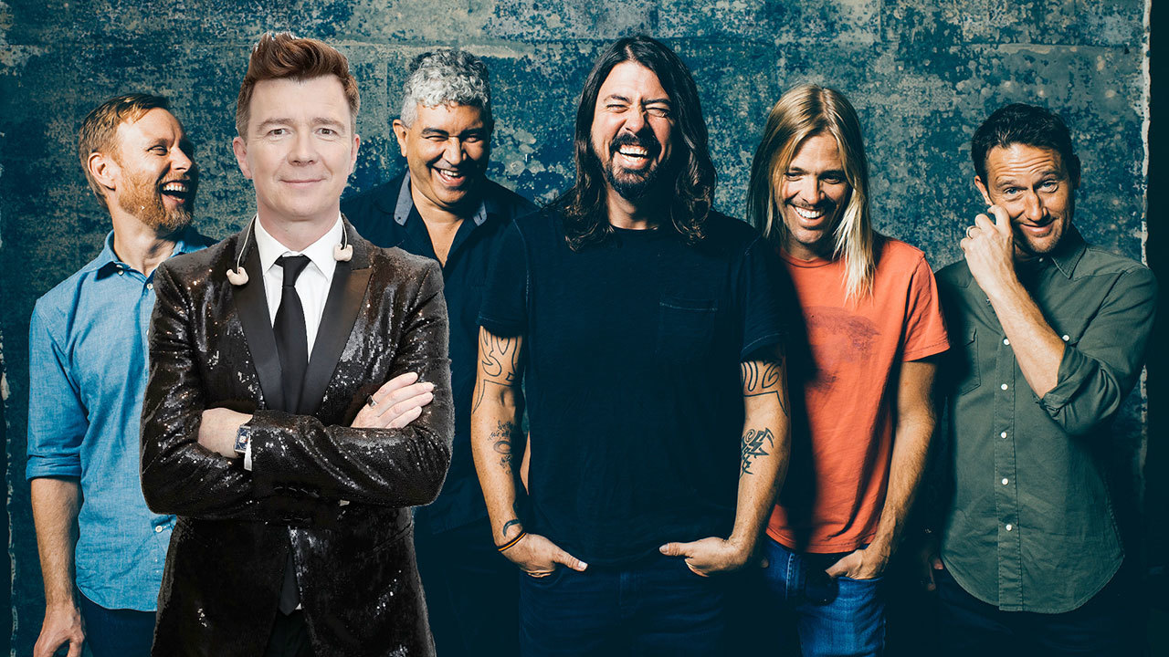 A press shot of the Foo Fighters with Rick Astley photoshopped in to it