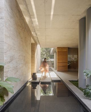 water feature and figure inside House of Gardens by Kanan Modi