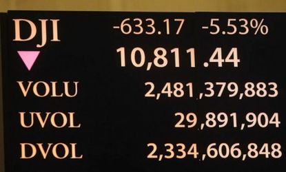 A New York Stock Exchange ticker shows Monday's massive stock market drop -- the steepest one-day decline since the 2008 financial crisis.