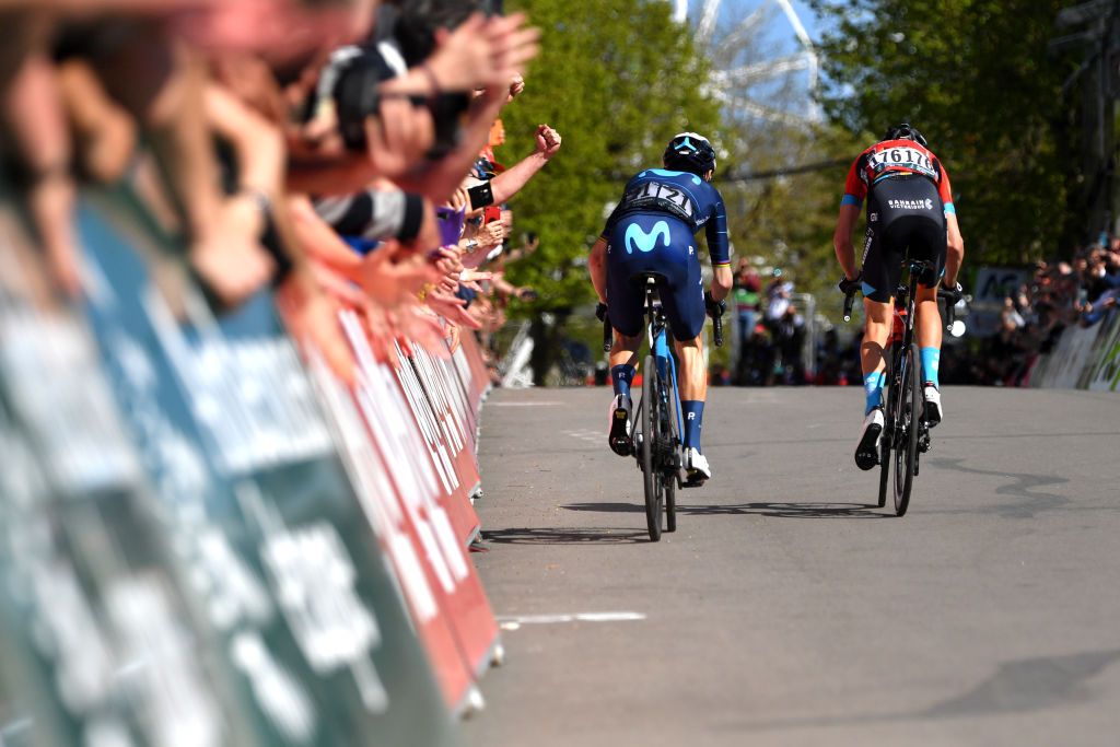 HUY BELGIUM APRIL 20LR Alejandro Valverde Belmonte of Spain and Movistar Team and Dylan Teuns of Belgium and Team Bahrain Victorious sprint at finish line during the 86th La Flche Wallonne 2022 Mens Elite a 2011km one day race from Blegny to Mur de Huy 204m WorldTour FlecheWallonne on April 20 2022 in Huy Belgium Photo by Luc ClaessenGetty Images